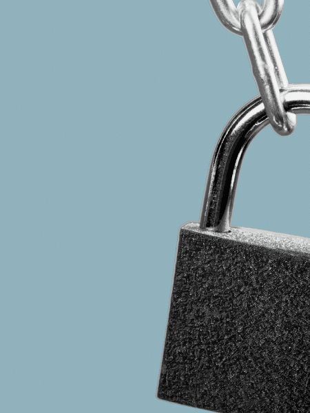 cut out image of a lock on a chain with a plain grey-blue background