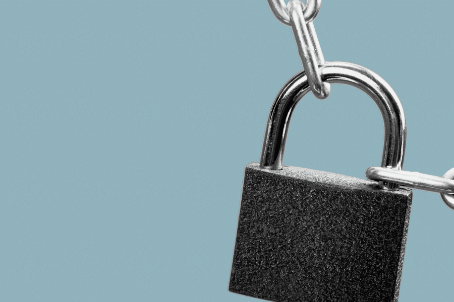 cut out image of a lock on a chain with a plain grey-blue background