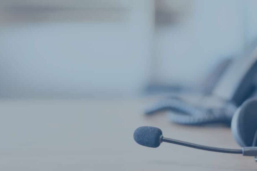 Close up image of corporate telephone with headset, representing blog titled: Sales process automation: Removing admin