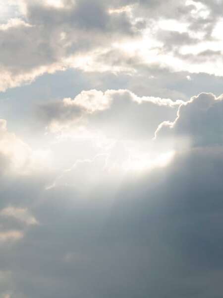 Cloudy grey sky with sunbeams. Used as a header image for a blog post titled: Doing EDI differently: Transalis launches new cloud EDI solutions