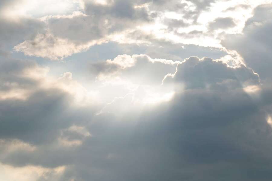 Cloudy grey sky with sunbeams. Used as a header image for a blog post titled: Doing EDI differently: Transalis launches new cloud EDI solutions